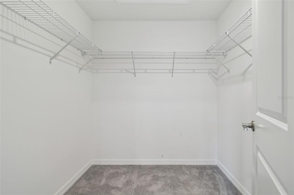 36390 Wl Hl Way Zephyrhills, FL 33541 - Photo 39 of 77 a view of a room with racks on the wall