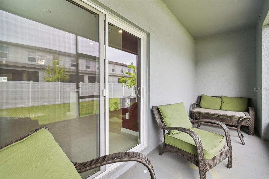 36390 Wl Hl Way Zephyrhills, FL 33541 - Photo 44 of 77 a view of a swimming pool with a chairs in a patio