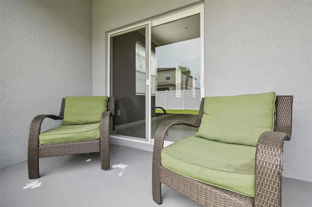 a view of a swimming pool with a patio