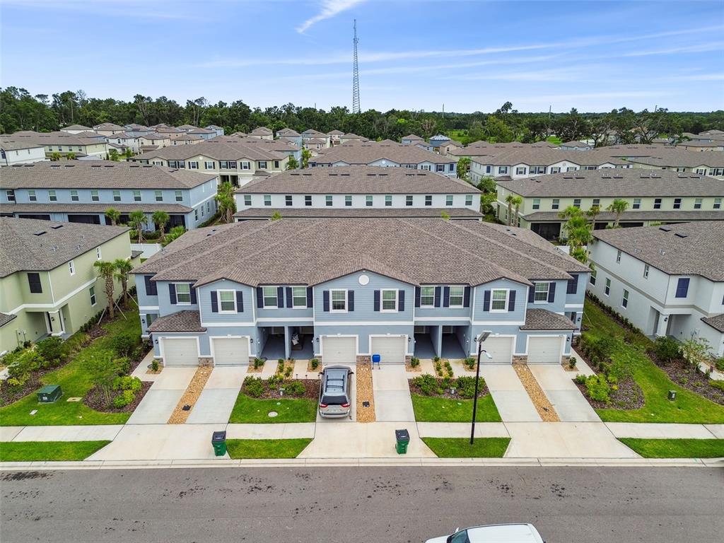 36390 Wl Hl Way Zephyrhills, FL 33541 - Photo 48 of 77 an aerial view of a house with a garden and plants