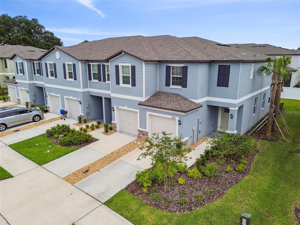 36390 Wl Hl Way Zephyrhills, FL 33541 - Photo 49 of 77 a front view of a house with a yard