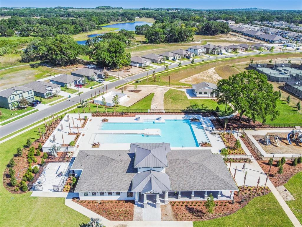 36390 Wl Hl Way Zephyrhills, FL 33541 - Photo 61 of 77 an aerial view of a house with a swimming pool