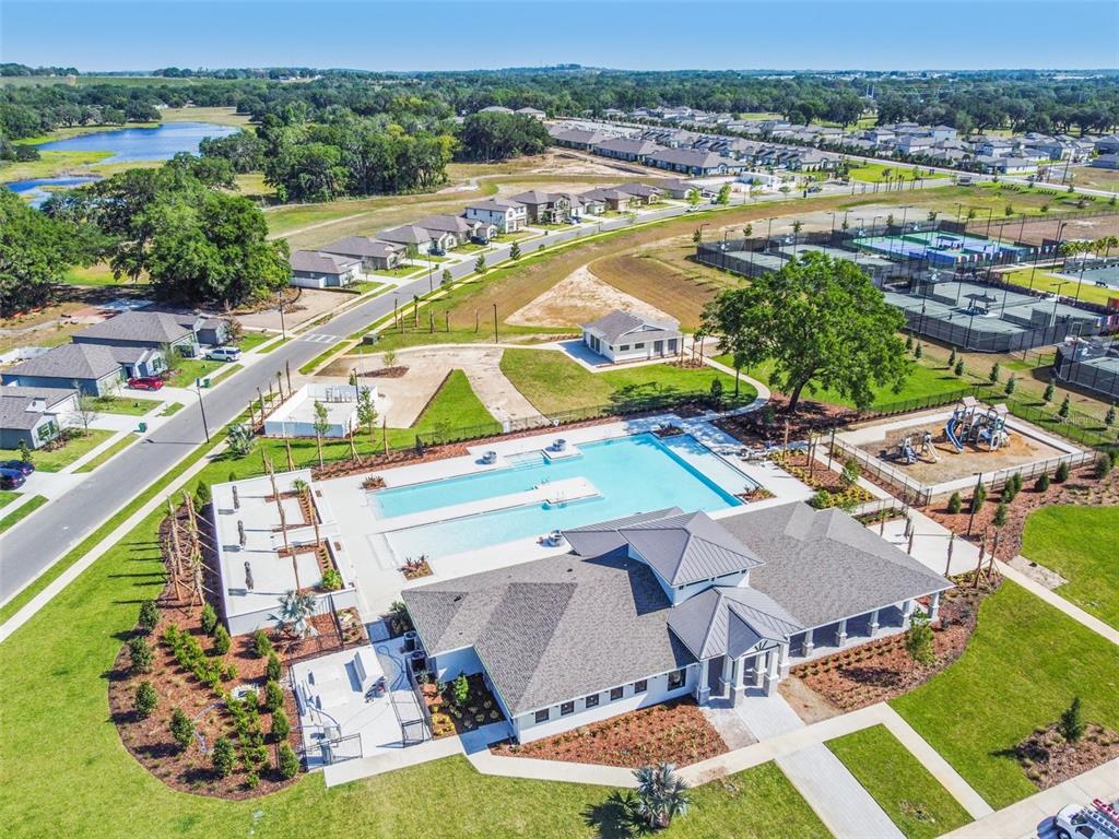 36390 Wl Hl Way Zephyrhills, FL 33541 - Photo 62 of 77 an aerial view of a house with a swimming pool yard and outdoor seating