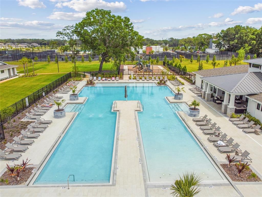 36390 Wl Hl Way Zephyrhills, FL 33541 - Photo 69 of 77 a view of swimming pool with outdoor seating and city view
