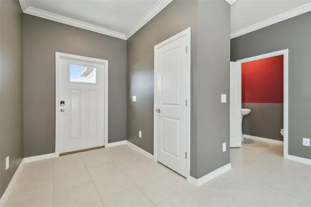 a view of an empty room with a kitchen