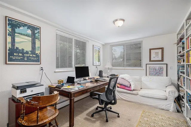 a workspace with furniture and a window