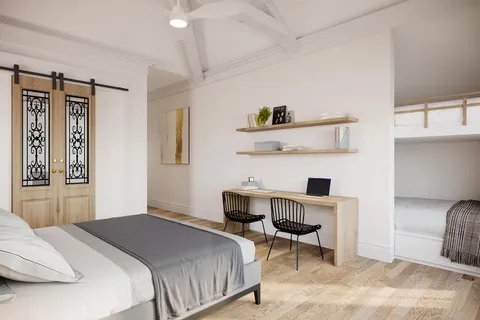 a bedroom with a bed a chair and a cabinets