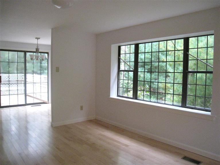 22 Quisset Road Centerville, MA 02632 - Photo 5 of 19 a view of an empty room with wooden floor and a window