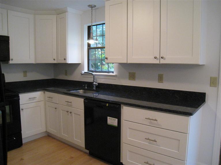 22 Quisset Road Centerville, MA 02632 - Photo 7 of 19 a kitchen with granite countertop white cabinets and a sink