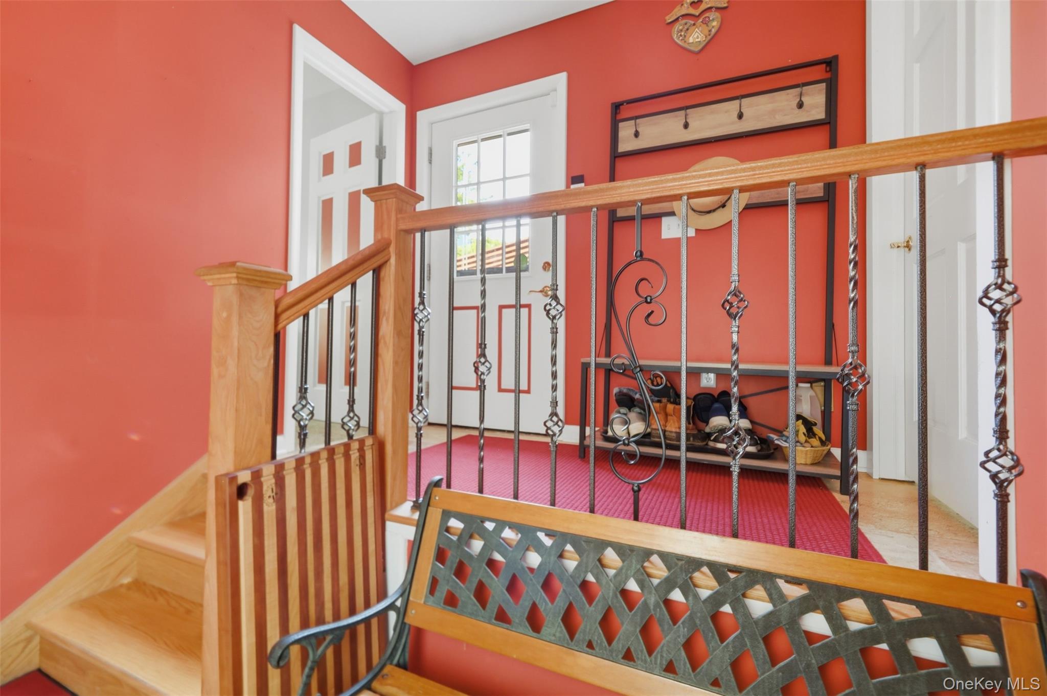 1 Hiko Place Fishkill, NY 12524 - Photo 23 of 41 Hardwood staircase with wrought iron balusters and a wood-finish handrail