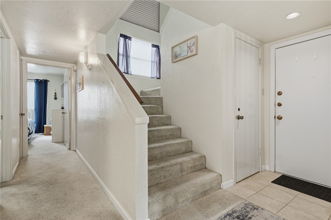 2003 North Fulton Beach Road, Unit 34 34 Rockport, TX 78382 - Photo 15 of 38 a view of a hallway with staircase