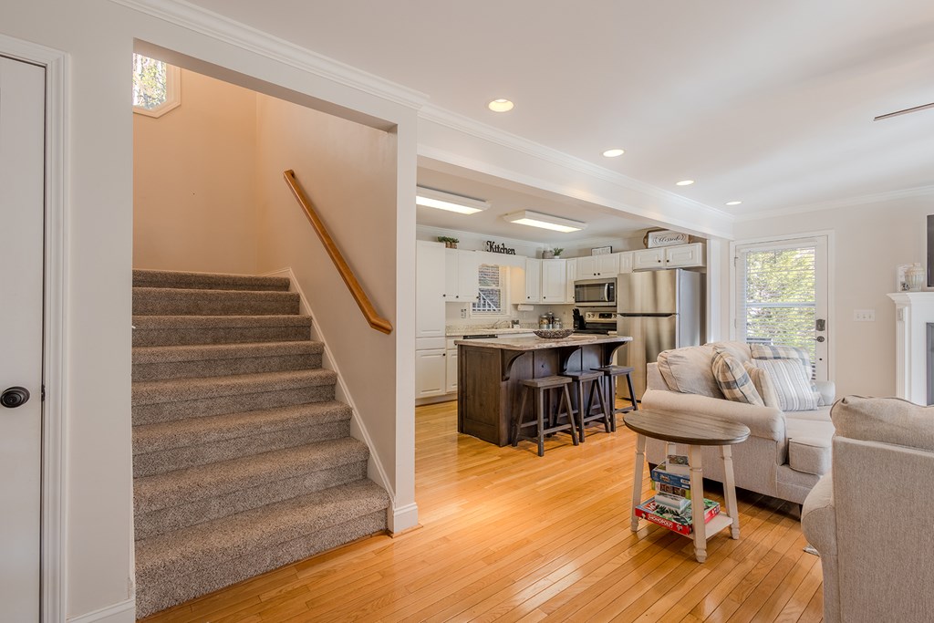 53 Addle Trail Ellijay, GA 30540 - Photo 16 of 50 a living room with furniture and a dining table with wooden floor