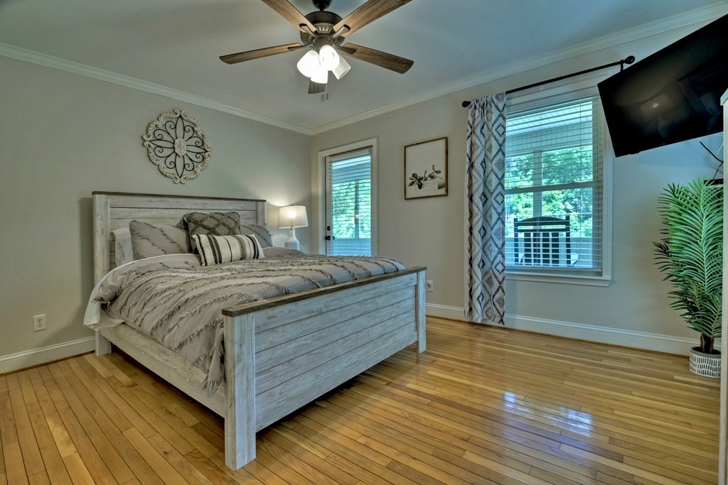 53 Addle Trail Ellijay, GA 30540 - Photo 21 of 50 a bedroom with a bed and a flat tv screen on dresser