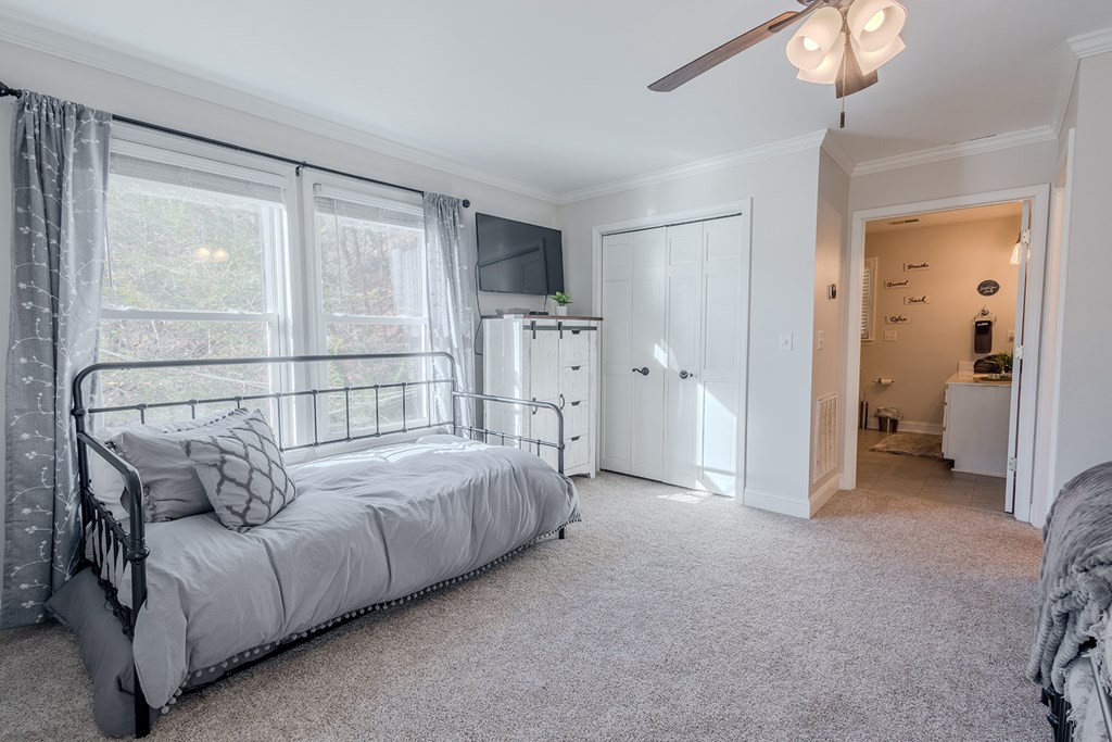 53 Addle Trail Ellijay, GA 30540 - Photo 27 of 50 a bed room with a bed and a chandelier