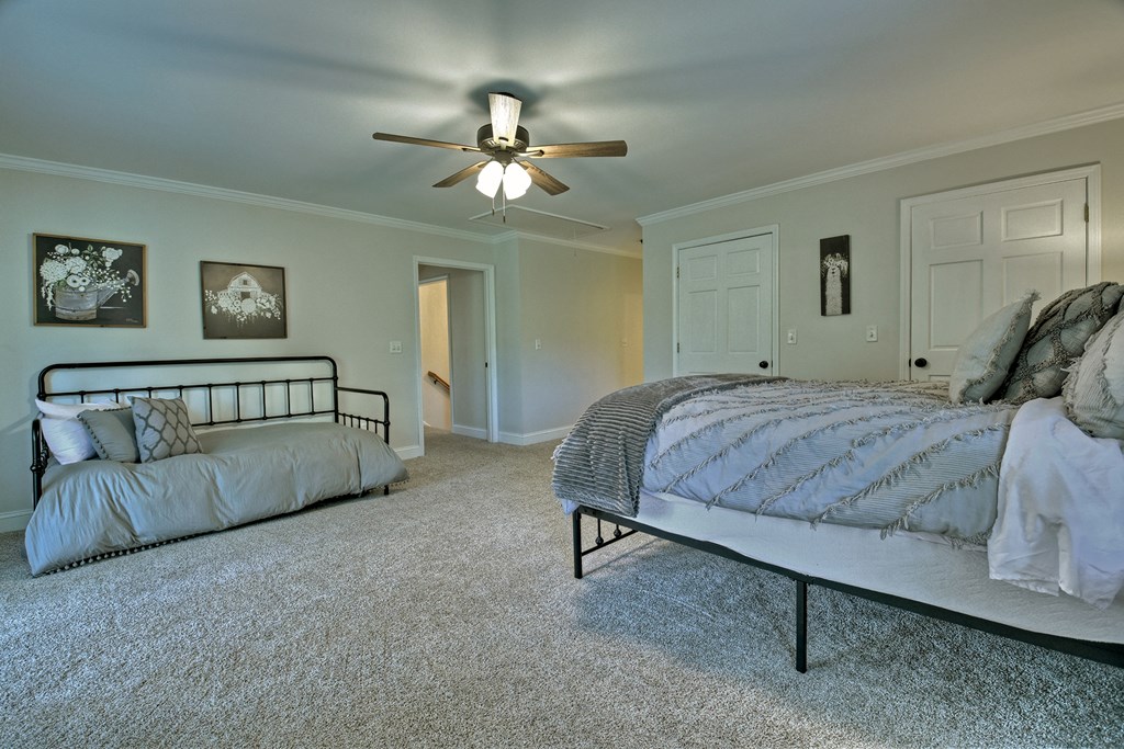 53 Addle Trail Ellijay, GA 30540 - Photo 33 of 50 a bedroom with a bed and a chandelier