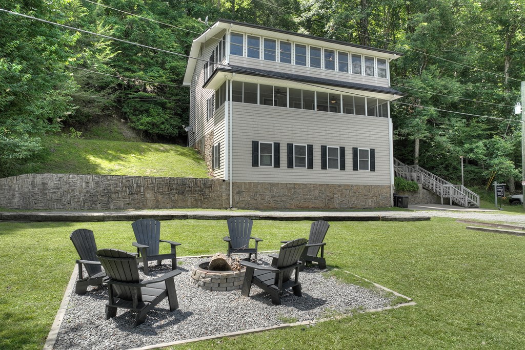 53 Addle Trail Ellijay, GA 30540 - Photo 38 of 50 a front view of a house with swimming pool having outdoor seating
