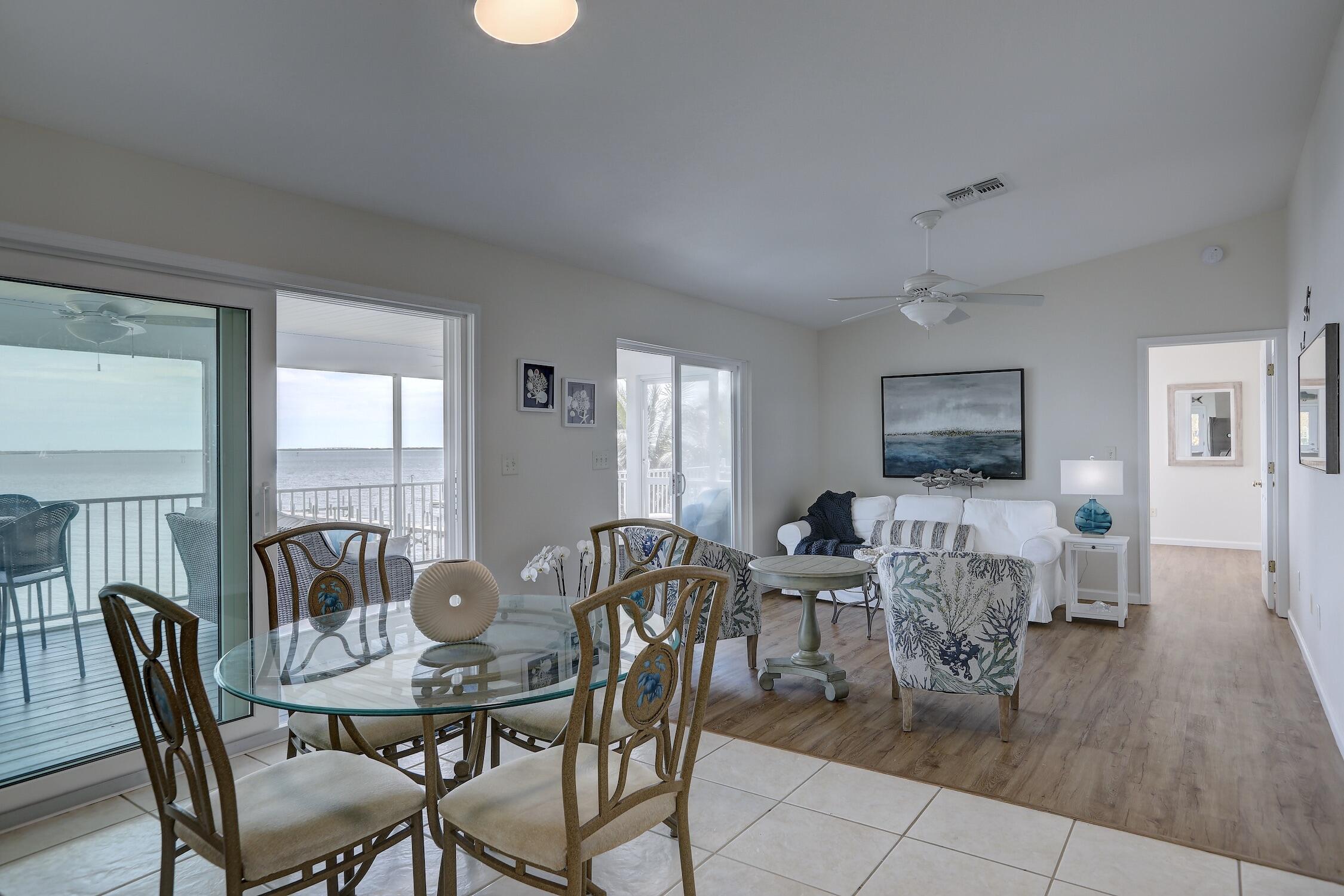 8825 Highway 1 Micco, FL 32976 - Photo 13 of 32 a view of a dining room with furniture window and wooden floor