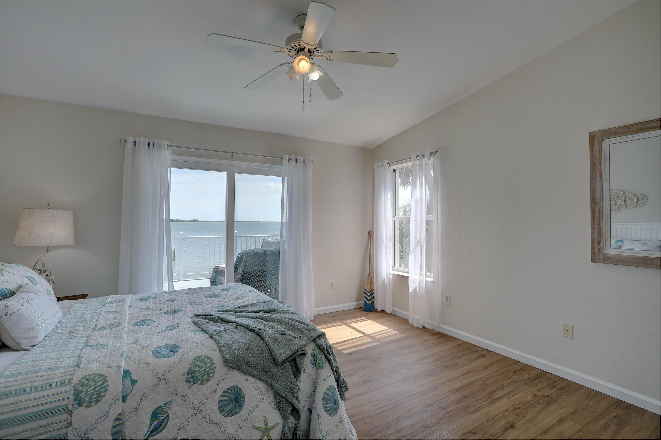 8825 Highway 1 Micco, FL 32976 - Photo 18 of 32 a bedroom with a large bed and a window