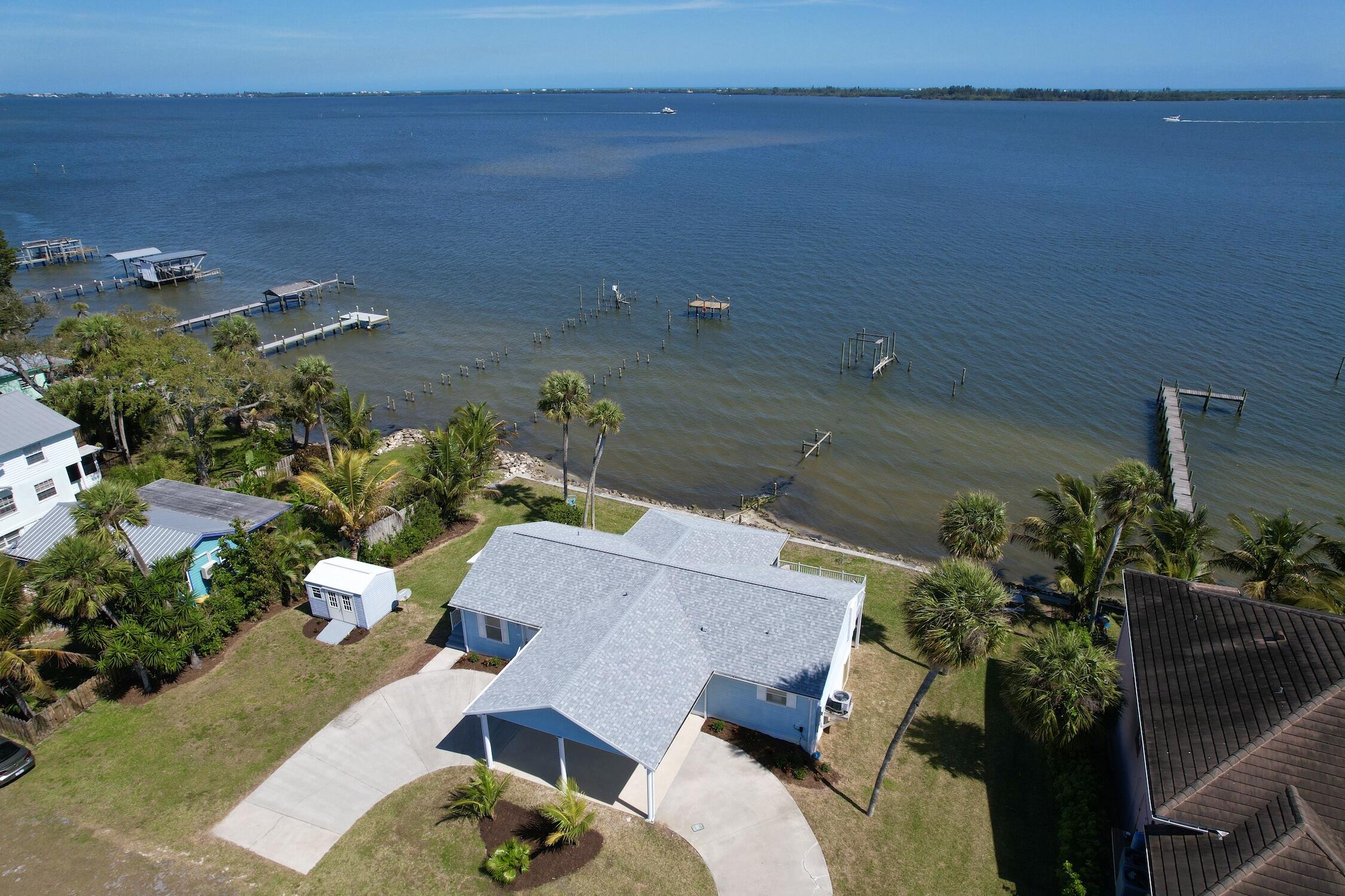 8825 Highway 1 Micco, FL 32976 - Photo 2 of 32 an aerial view of a house with a yard