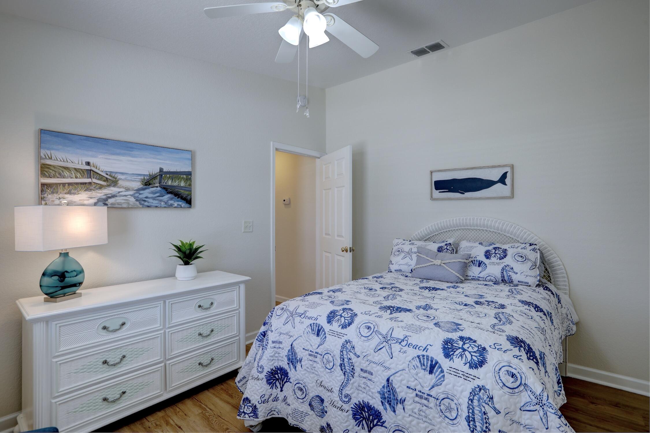 8825 Highway 1 Micco, FL 32976 - Photo 24 of 32 a bedroom with a bed and a potted plant on the dresser