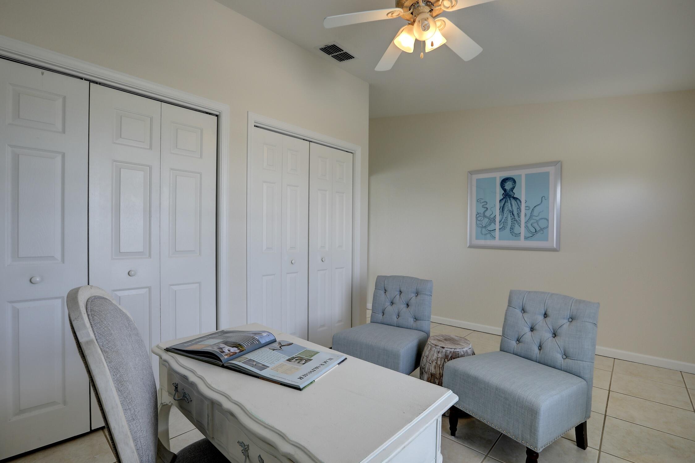 8825 Highway 1 Micco, FL 32976 - Photo 28 of 32 a living room with furniture and a chandelier