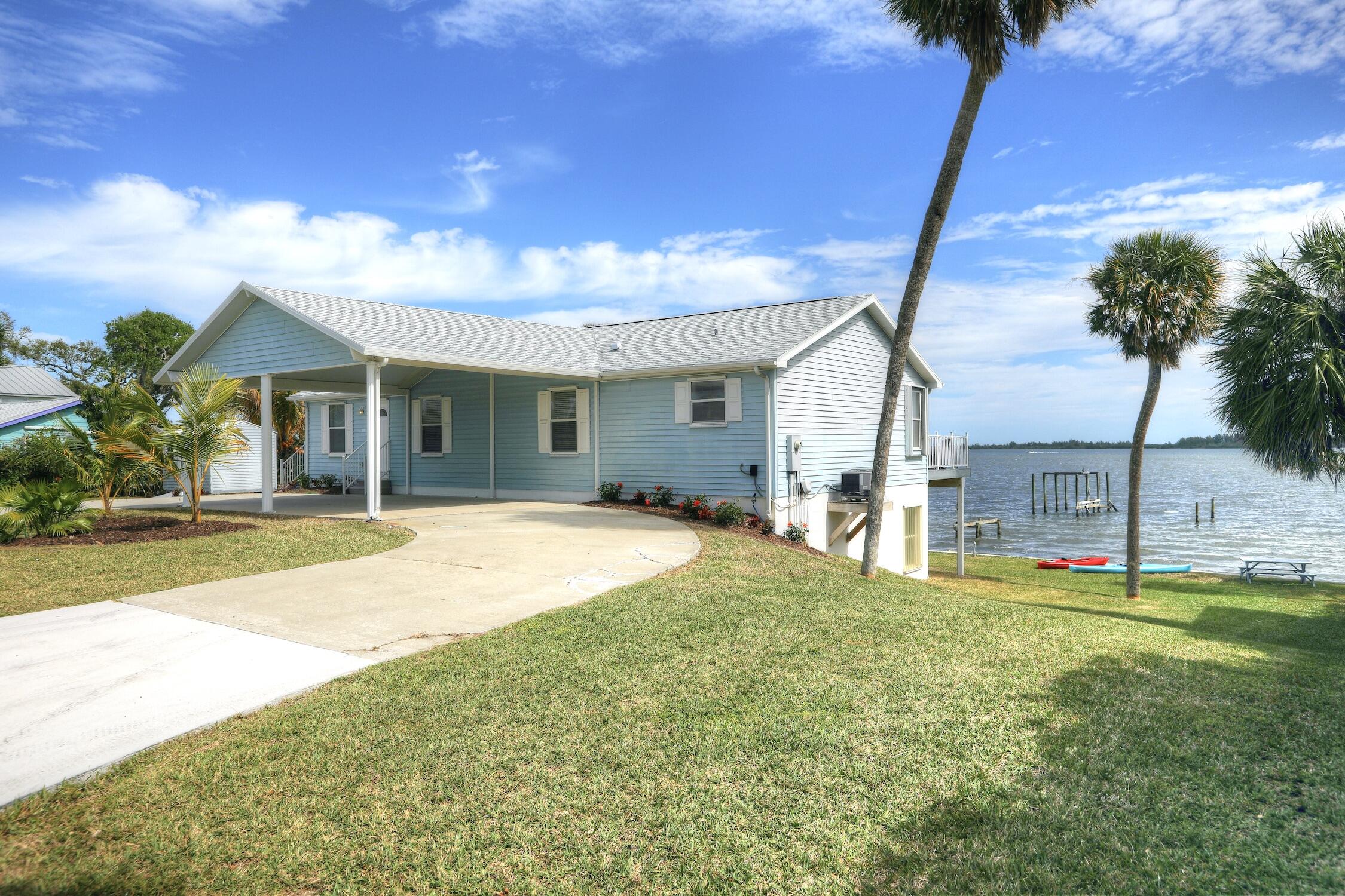 8825 Highway 1 Micco, FL 32976 - Photo 4 of 32 a view of a house with a backyard and a tree