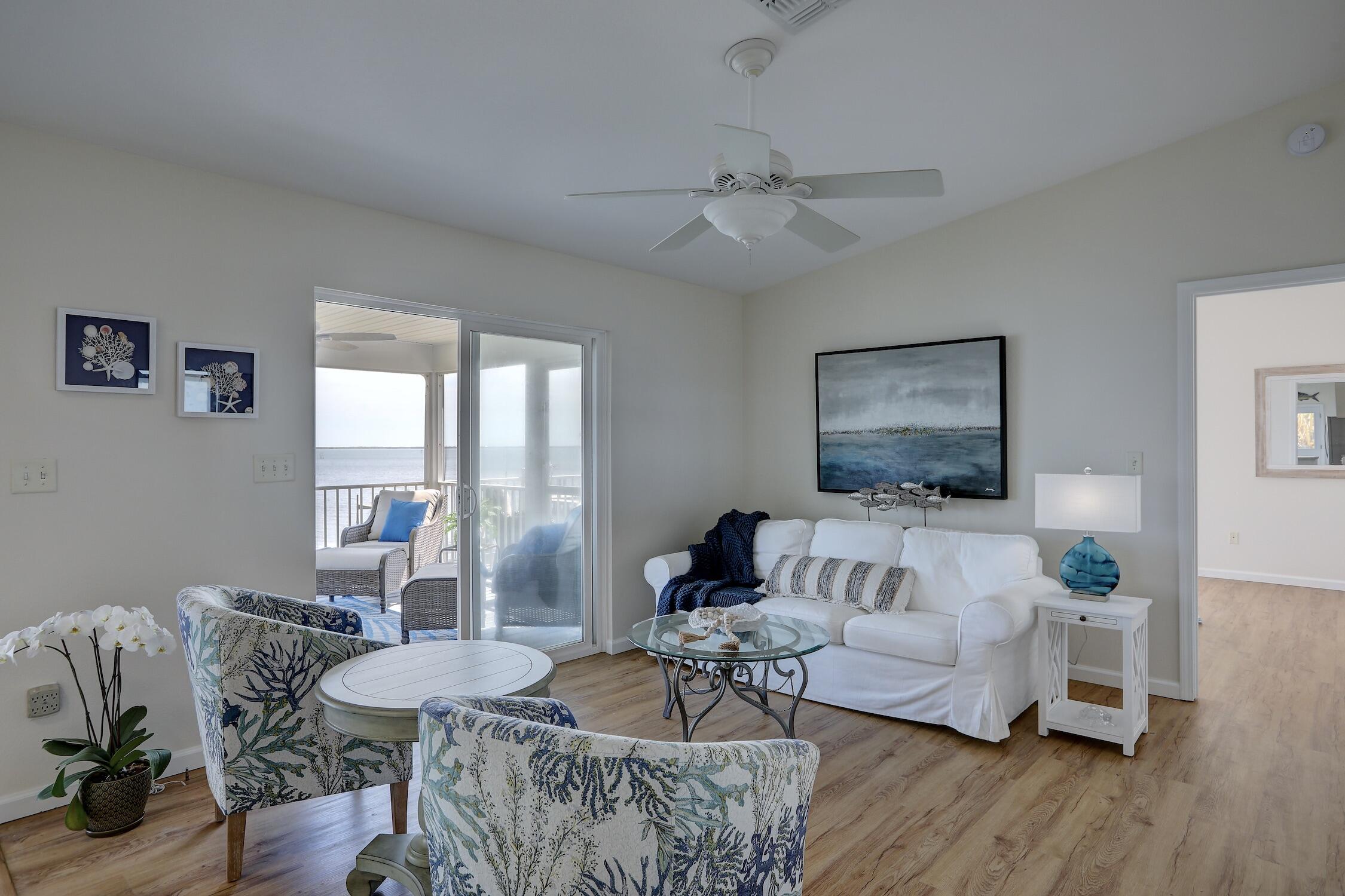 8825 Highway 1 Micco, FL 32976 - Photo 10 of 32 a living room with furniture and a flat screen tv
