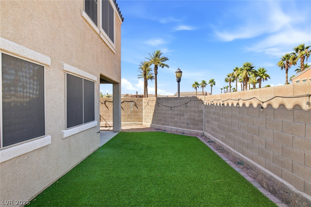 48 Jasmine Point Street Henderson, NV 89074 - Photo 56 of 62 A private, low-maintenance yard offers an ideal outdoor retreat.