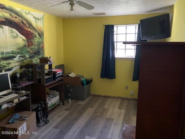 6640 Terry Road Jacksonville, FL 32216 - Photo 12 of 25 a room with wooden floor and a window