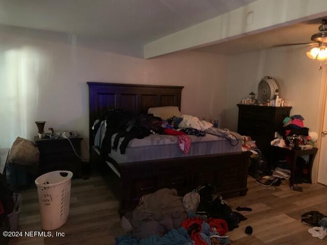 6640 Terry Road Jacksonville, FL 32216 - Photo 20 of 25 a bed room with a bed and a couch