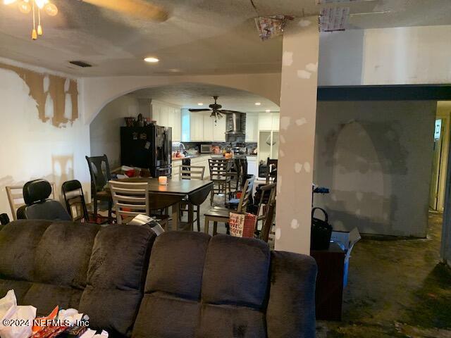 6640 Terry Road Jacksonville, FL 32216 - Photo 7 of 25 a living room with furniture and a piano