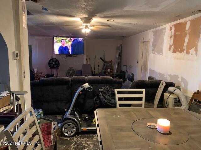 6640 Terry Road Jacksonville, FL 32216 - Photo 8 of 25 a living room with furniture and a flat screen tv