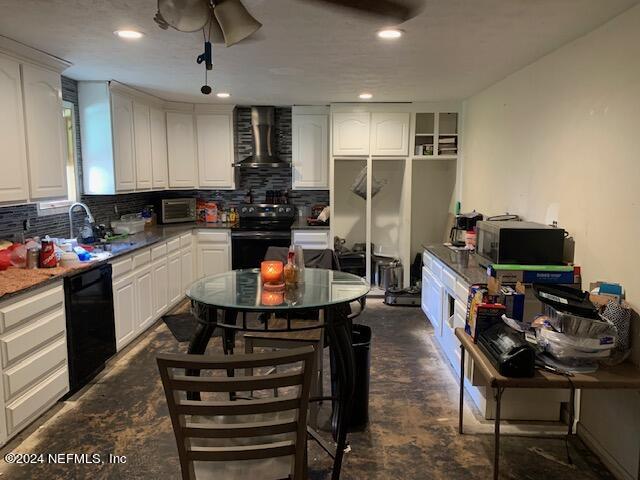 6640 Terry Road Jacksonville, FL 32216 - Photo 10 of 25 a kitchen with stainless steel appliances a refrigerator a stove a sink a stove a dining table and chairs with wooden floor