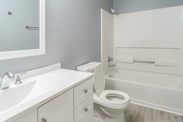 a bathroom with a sink a toilet and a bathtub