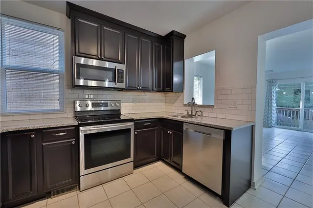 a kitchen with a sink and cabinets