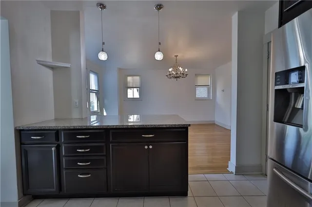 a kitchen with stainless steel appliances granite countertop a sink and cabinets