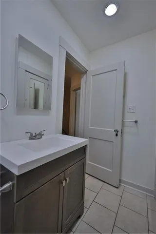 a bathroom with a tub and shower