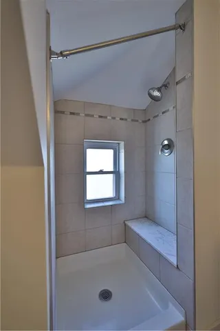 a view of a room with wooden floor and window