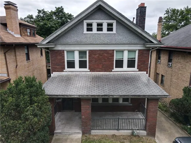 an aerial view of a city with lots of residential buildings