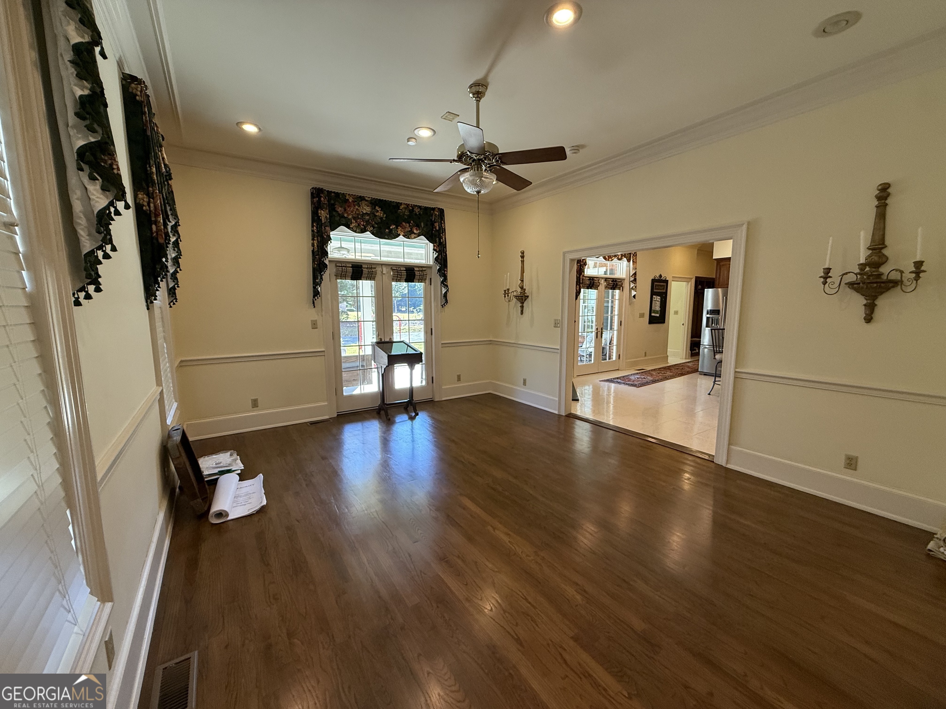 113 Parks Ridge Road Dublin, GA 31021 - Photo 28 of 99 a view of a livingroom with wooden floor and a ceiling fan