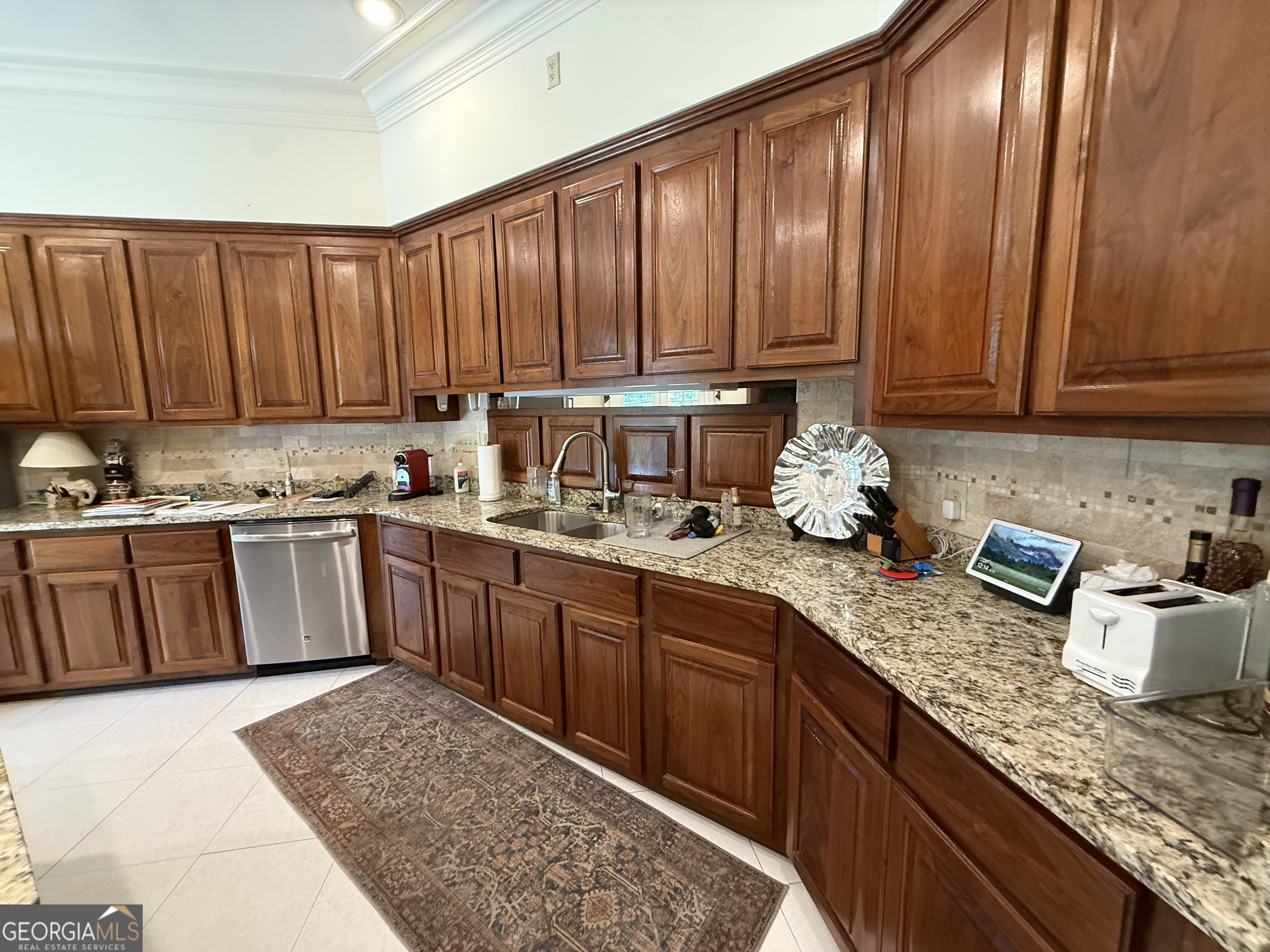 113 Parks Ridge Road Dublin, GA 31021 - Photo 32 of 99 a kitchen with kitchen island granite countertop wooden cabinets a sink and dishwasher