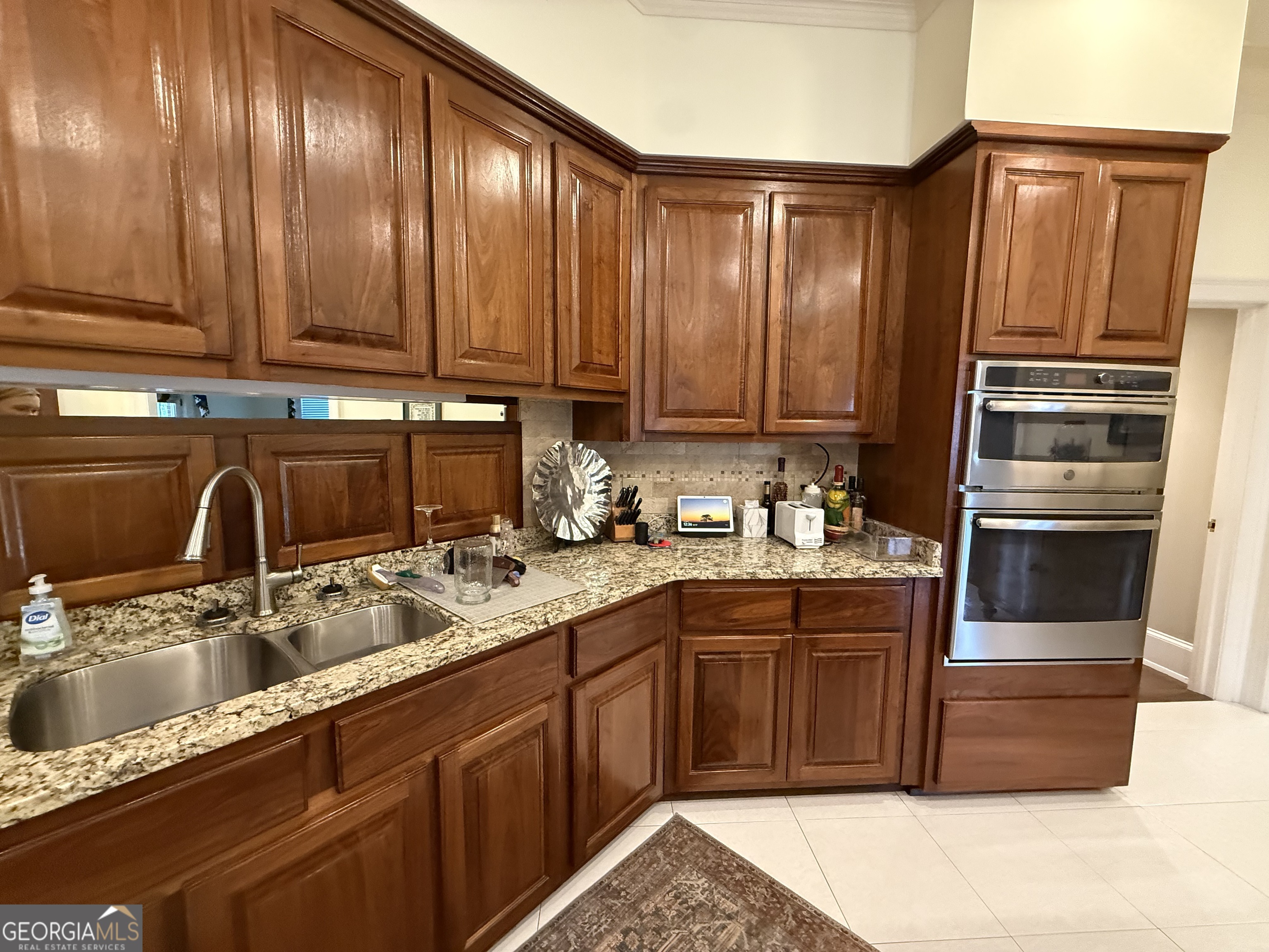 113 Parks Ridge Road Dublin, GA 31021 - Photo 36 of 99 a kitchen with stainless steel appliances granite countertop a sink stove and refrigerator