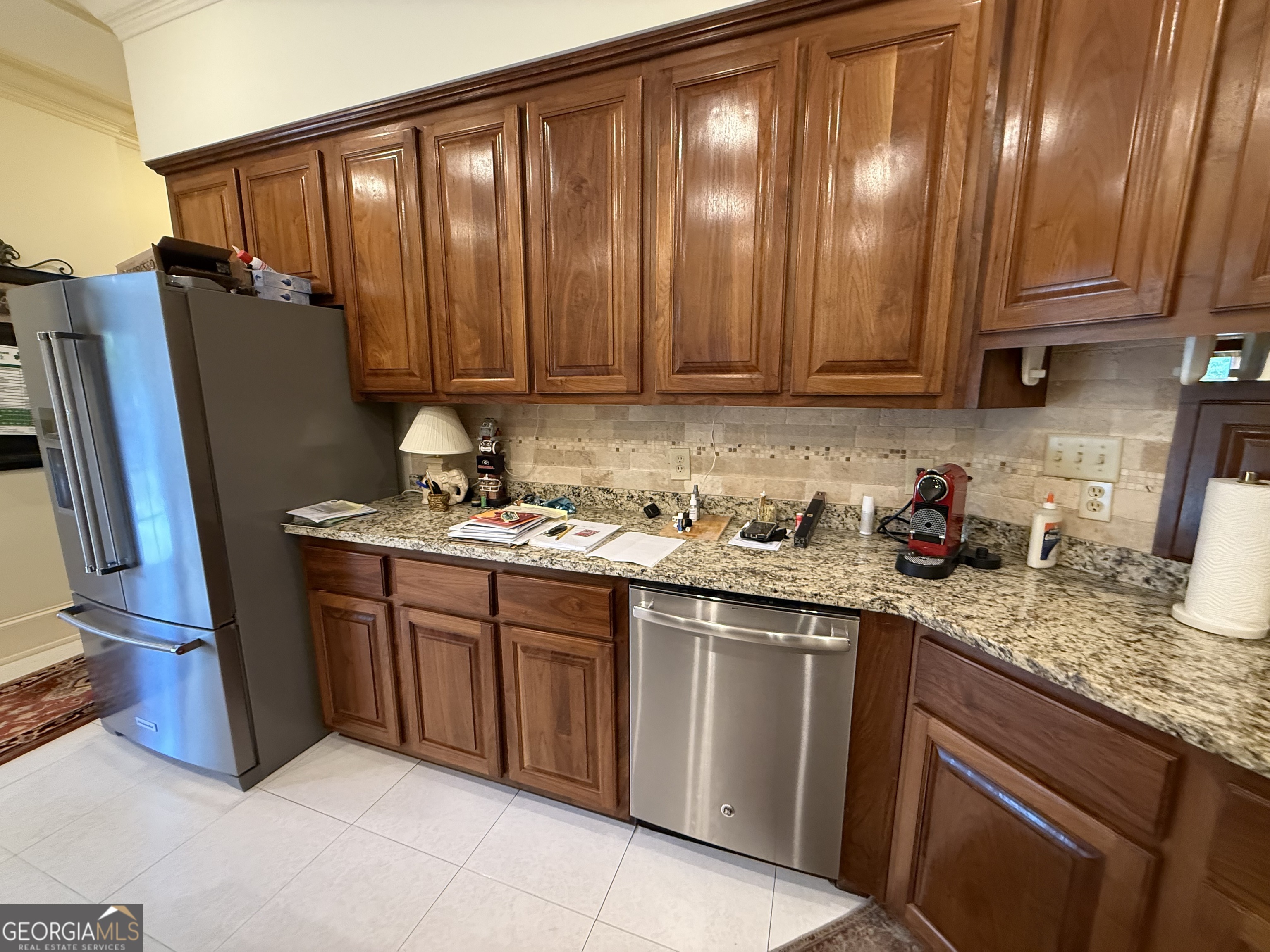 113 Parks Ridge Road Dublin, GA 31021 - Photo 37 of 99 a kitchen with stainless steel appliances granite countertop a sink refrigerator and cabinets