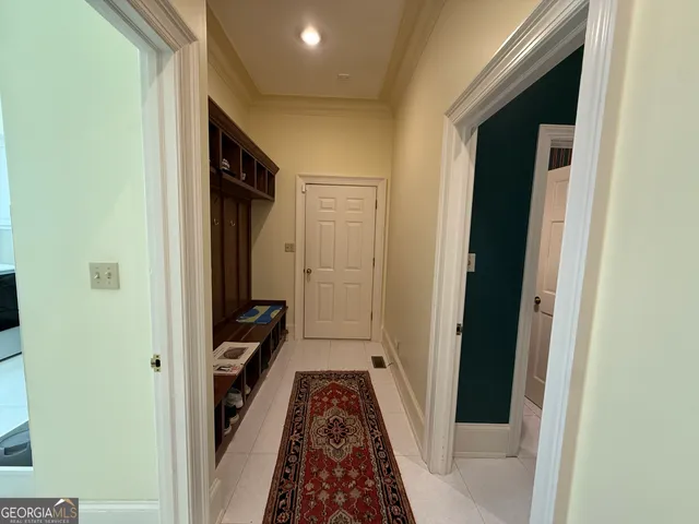 a bedroom with a large bed and a flat screen tv