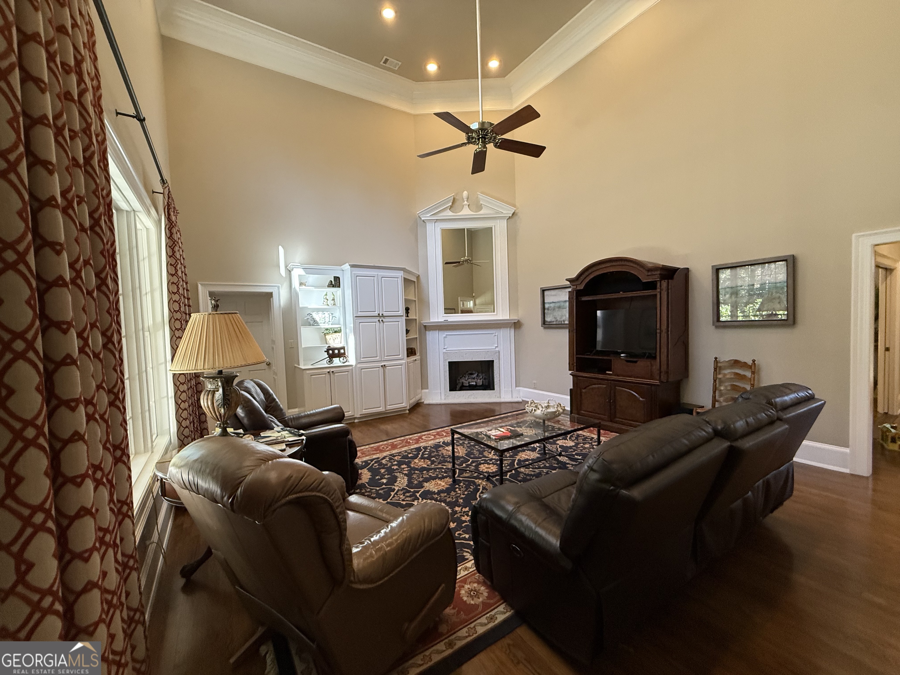 113 Parks Ridge Road Dublin, GA 31021 - Photo 58 of 99 a living room with furniture fireplace and a flat screen tv