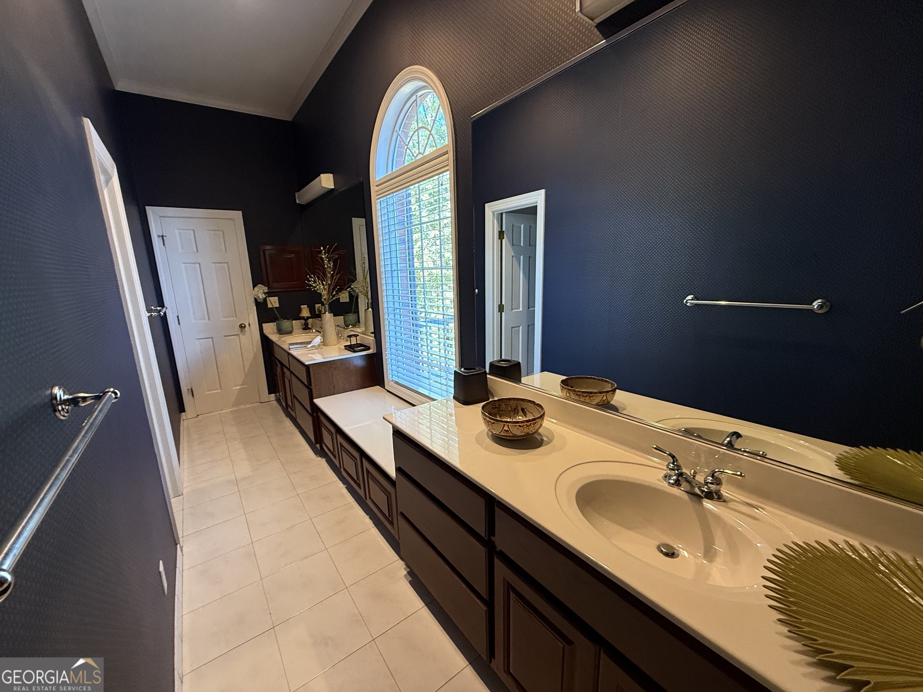 113 Parks Ridge Road Dublin, GA 31021 - Photo 76 of 99 a en suite bathroom with a granite countertop sink and a large mirror