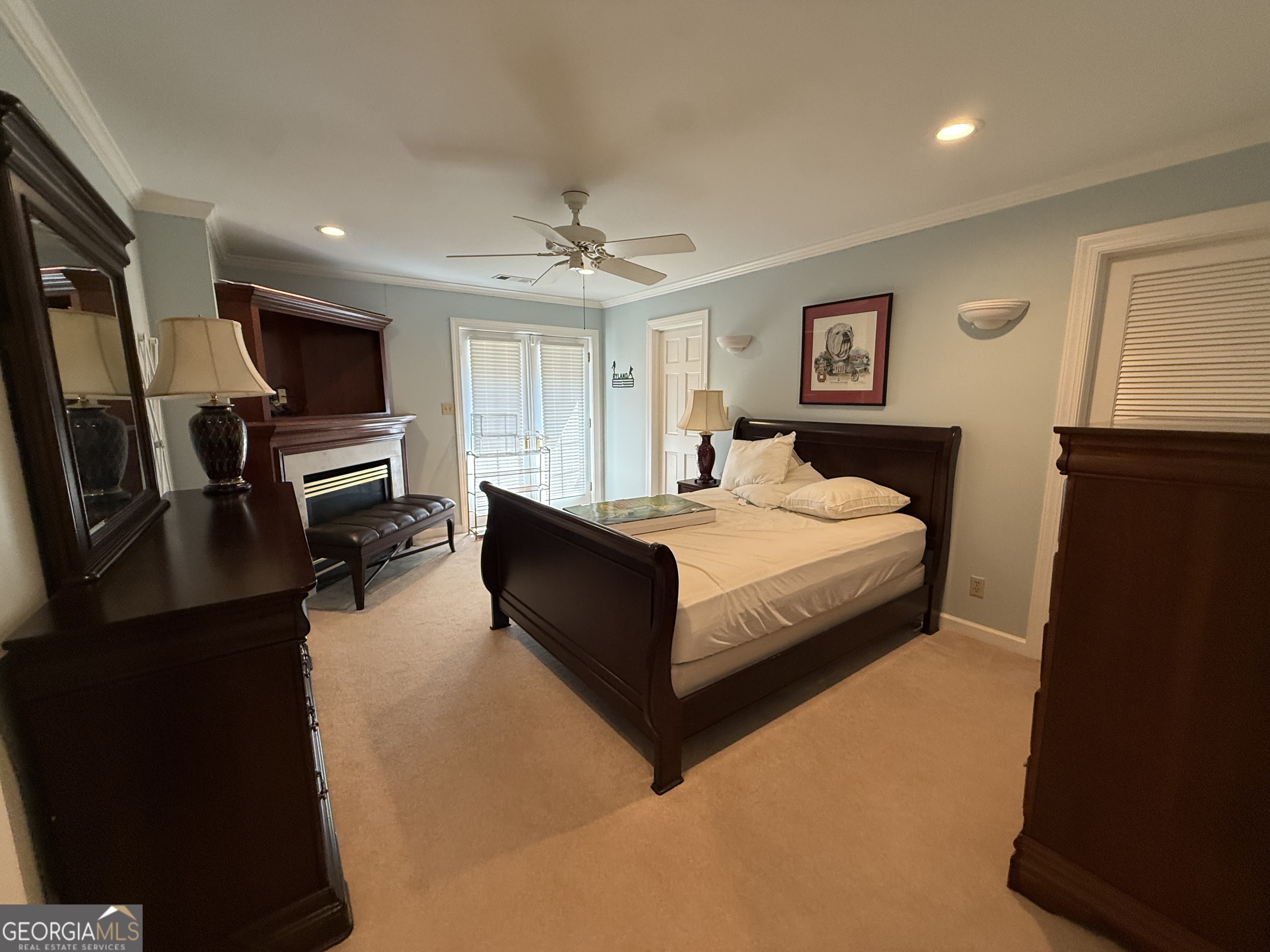 113 Parks Ridge Road Dublin, GA 31021 - Photo 83 of 99 a bedroom with a large bed and a flat screen tv