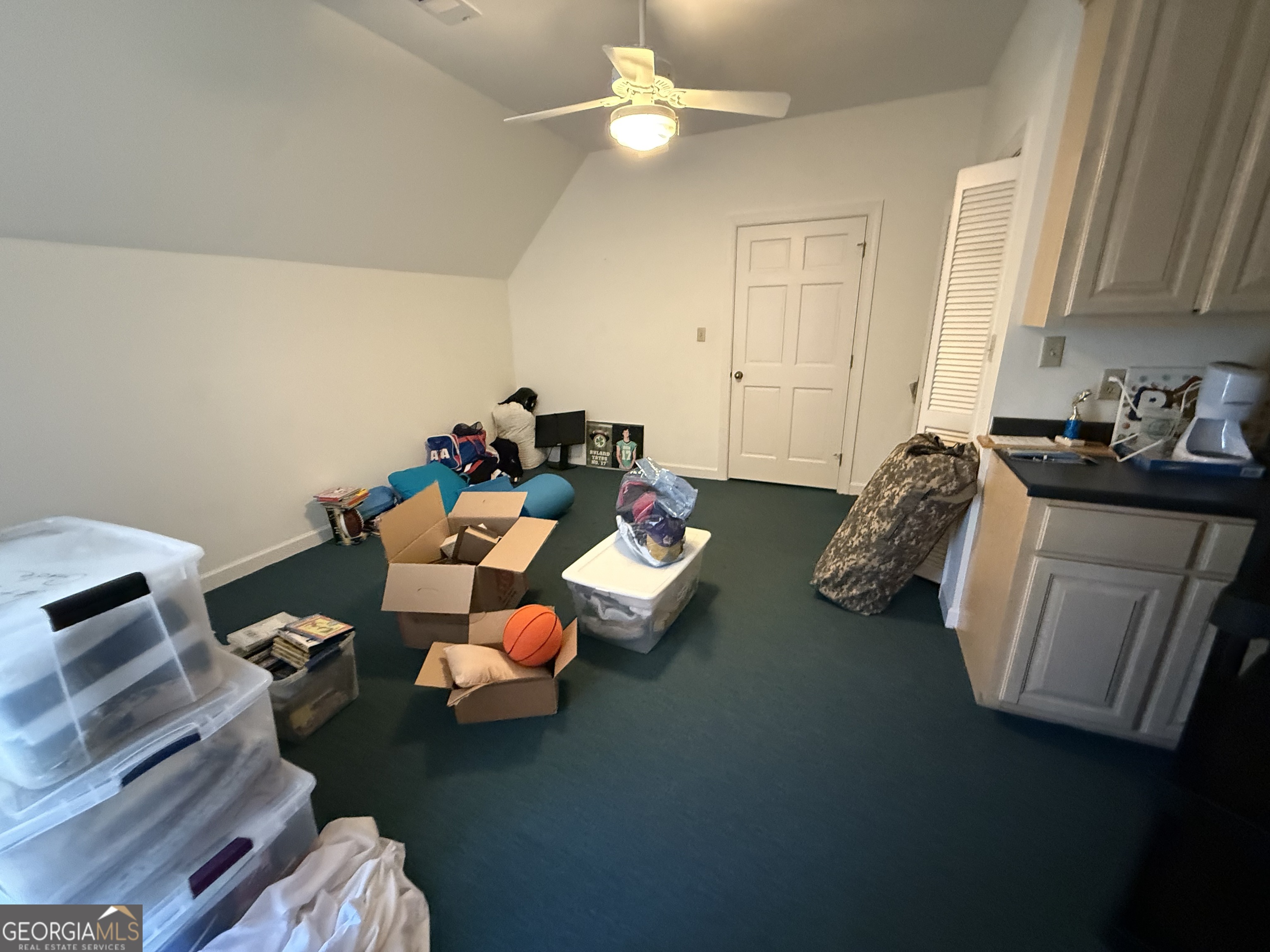 113 Parks Ridge Road Dublin, GA 31021 - Photo 89 of 99 a bed room with furniture and a chandelier