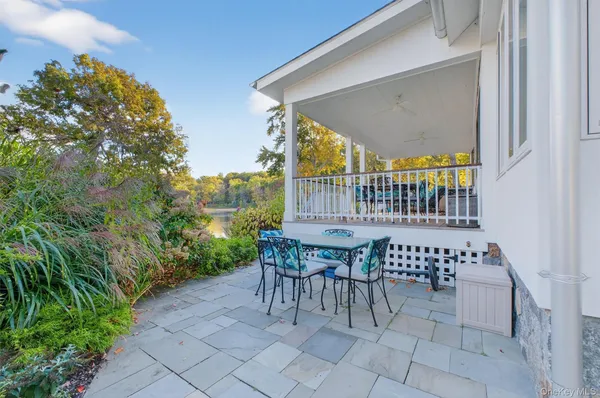 a view of a patio with iron fence
