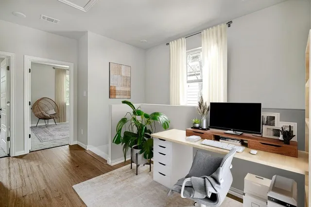 a workspace with furniture and a window